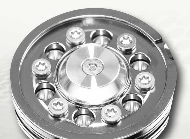 A precision machined round housing with a ring of bolts