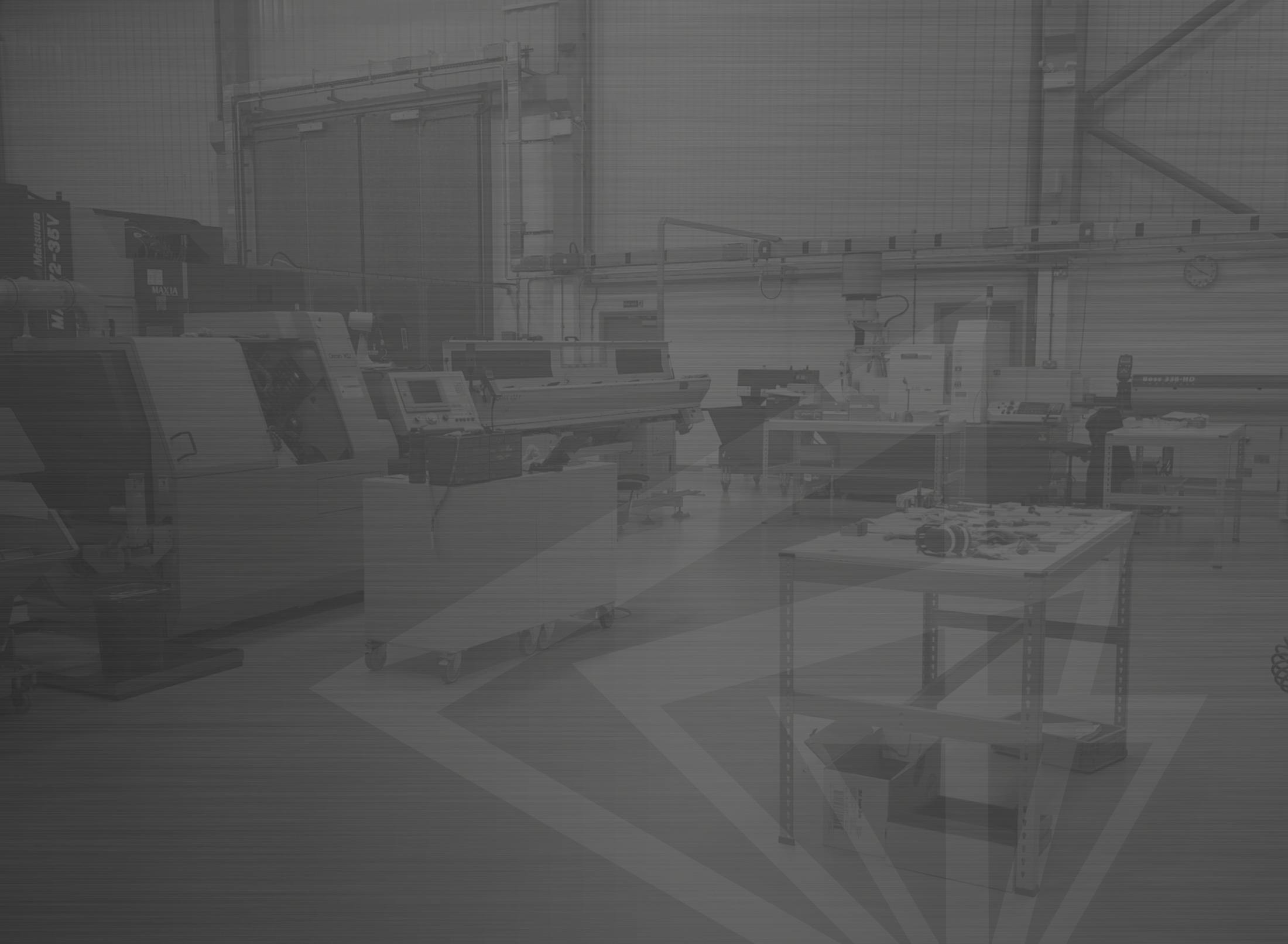 A grey-toned photo of the CNF machine shop floor