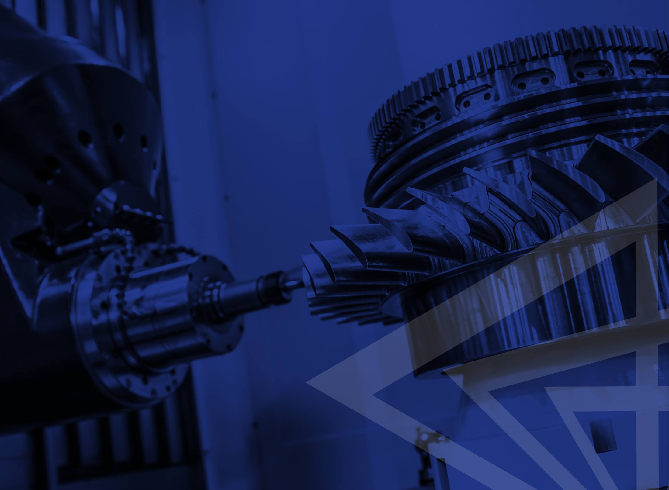 A blue-toned close-up of a multi-axis machine cutting a large gear ring